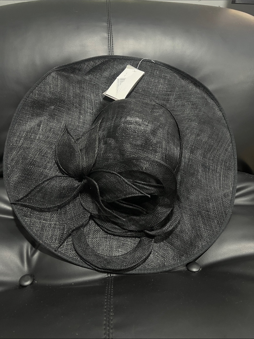 Elegant Black Wide-Brim Dress Hat with Sculpted Floral Accent
